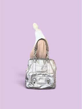 Silver metallic leather coach handbag with chain strap